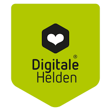 Logo: Digitale Helden steht in schwarzer Schrift auf grünem Hintergrund. Darüber sieht man ein weißes Herz in einem schwarzen Rechteck. 